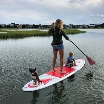 Dog paddleboarding with family